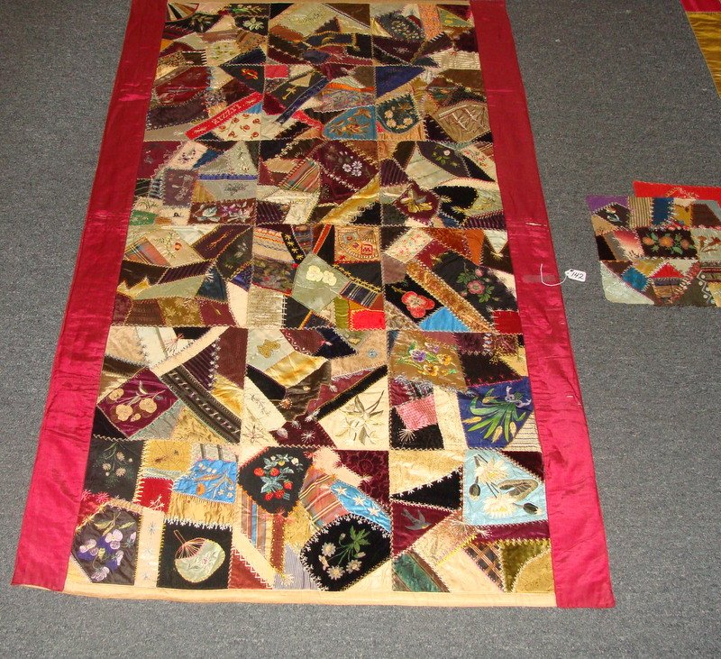 19th Century Silk Crazy Quilt – Crib Size w/ Embro: 19th Century Hand Made Crib Size Silk Crazy Quilt; 40.75" x 68" Length. Has the Name Lizzie Stitched into It and is Decorated with Different Designs Such as a Boat, a lady with a Dog, Horse & Wagon & 