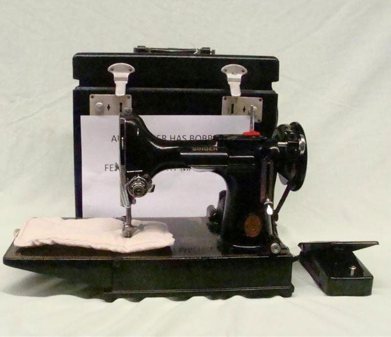 Vintage Singer Featherweight Sewing Machine Model: Singer Featherweight Sewing machine Model 221-A. Serial # E708156. Comes with Case & Attachments. Case & Machine in Very Good Condition, Bobbin Enclosed. Auction Estimate $300-500.