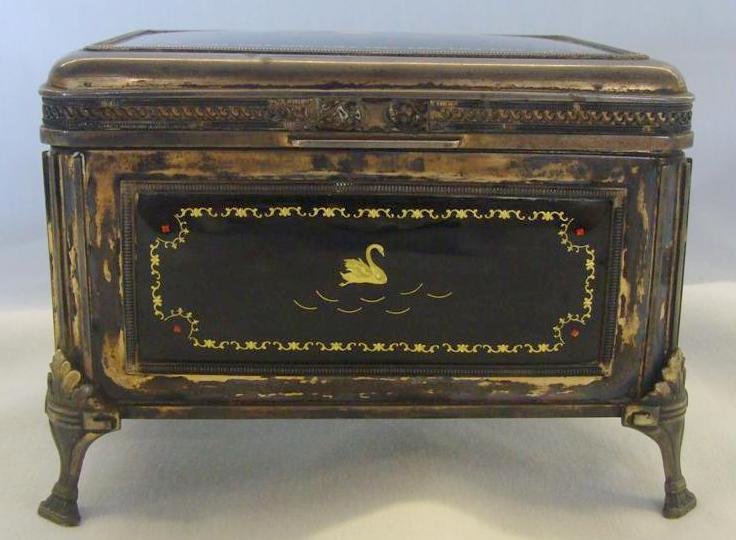 19c French Silver Jewelry Casket: Enameled Panels : 19th Century French Silver Footed Jewelry Casket with Interior Milk Glass Panels and Black Enameled Exterior Panels with Jeweled Gilt Scrolling & Centered Swan. 5" x 4" & 3.5" Ht. Auction Estimate $40