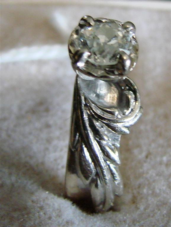 14K Yellow & White Gold Diamond Ring Size 7.5: 14K Yellow & White Solid Gold Diamond Ring in a Flower Form Setting, Approx 1/2 ct. Size 7.5; 5.5 Grams. Auction Estimate $500-700.