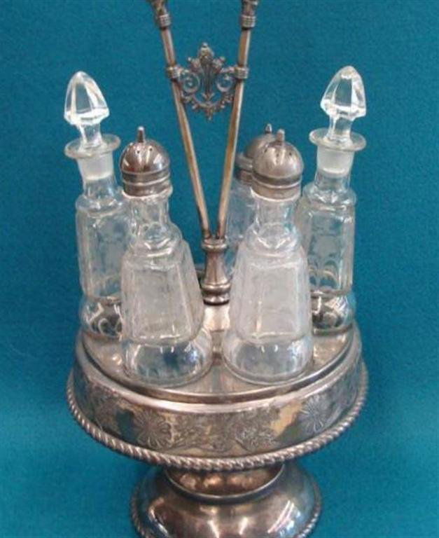 Antique Silver & Crystal Castor Set. Note: Missing one: Antique Silver & Crystal Castor Set. Note: Missing one Bottle. Auction Estimate: $100-200.