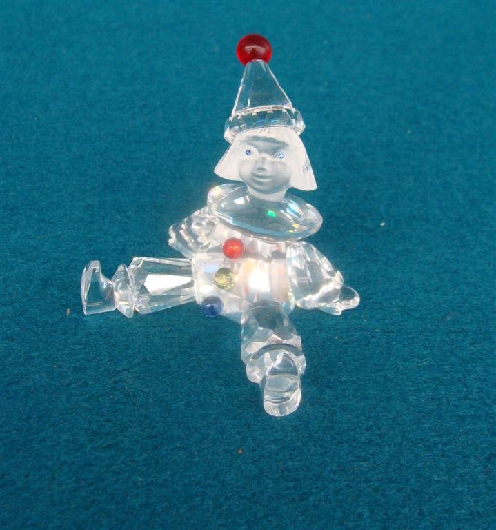 Signed Swarovski Crystal Puppet Clown, Red Ball on Tip: Signed Swarovski Crystal Puppet Clown, Red Ball on Tip of Hat & Multi Colored Balls on Costume; Original Box. Auction Estimate: $75-150.