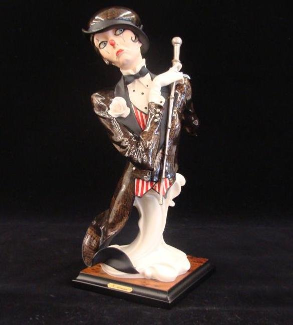Giuseppe Armani Figurine: Bittersweet #528C. Depicts a: Giuseppe Armani Figurine: Bittersweet #528C. Depicts a Lady Harlequin Bust with Cane & Striped Vest with Tuxedo Tails. Auction Estimate: $200-400.