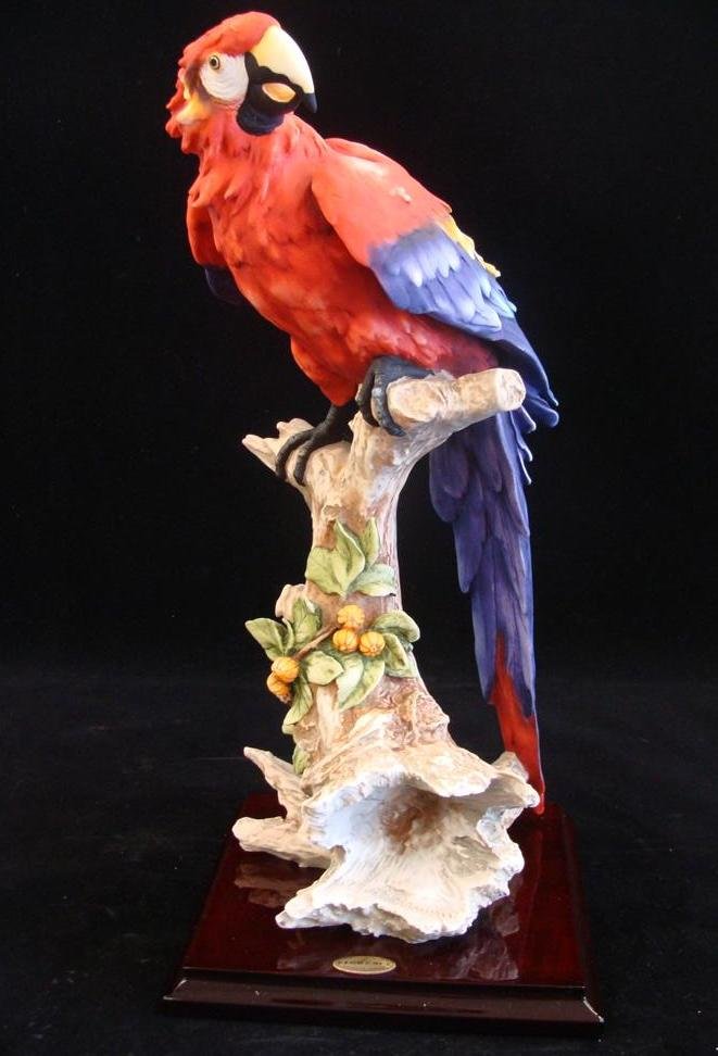 Giuseppe Armani Figurine: Macaw #277C. Depicts Vibrant: Giuseppe Armani Figurine: Macaw #277C. Depicts Vibrant Scarlet Macaw on Branch with Vines Growing Around. 15.5" Ht Box & COA Included. Auction Estimate: $400-600.