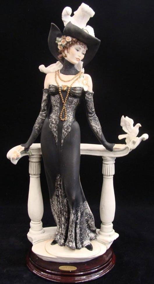 Giuseppe Armani Figurine: Spring Morning #337C. Ltd Ed: Giuseppe Armani Figurine: Spring Morning #337C. Ltd Ed #1835/3000. Depicts Lady in Mae West Style Dress & Hat, Leaning against Bannister with Dove on it. 19.5" Ht. Box & COA. Auction Estimate: $400- 6