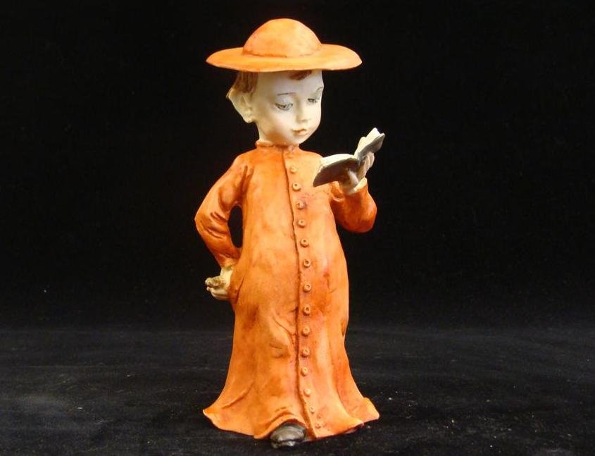 Giuseppe Armani Figurine: Little Father #3368C, 1976 Ed: Giuseppe Armani Figurine: Little Father #3368C, 1976 Edition. Depicts Young Boy Dressed as a Priest (Padre) with Orange Robe and Hat. Auction Estimate: $100-200.
