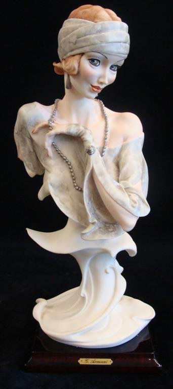 Giuseppe Armani Figurine: Temptation #522P. Artist Sign: Giuseppe Armani Figurine: Temptation #522P. Artist Signed Giuseppe Armani. Depicts Bust of Art Deco Lady in a Demure Pose. 13.5" Ht. Box & COA. Auction Estimate: $150-250.