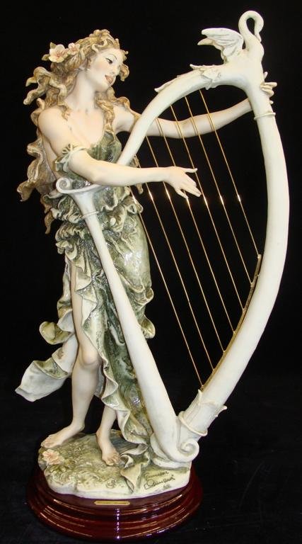 Giuseppe Armani Figurine: Angelica #484C. Ltd Ed #563/: Giuseppe Armani Figurine: Angelica #484C. Ltd Ed #563/ 5000. Artist Signed Connie Ribaudo. Depicts Lady Playing Harp Embellished with Swan on Top. 18" Ht & 12" Wd. Box & COA. Auction Estimate: $500-70