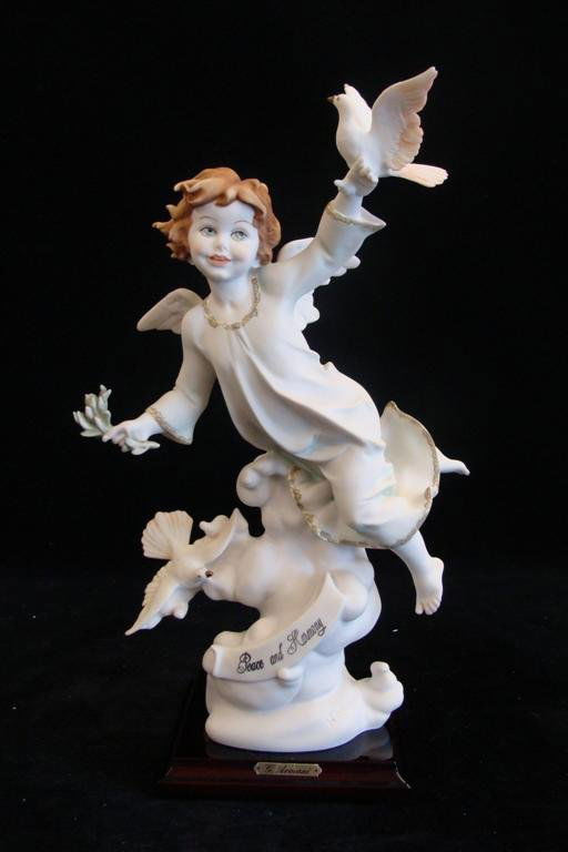 Giuseppe Armani Figurine: Peace & Harmony #824C. This P: Giuseppe Armani Figurine: Peace & Harmony #824C. This Piece was made at the End of The Gulf War. Depicts Angel Extending Peace & Harmony to the World. 14" Ht. Box & COA. Auction Estimate: $150-250.