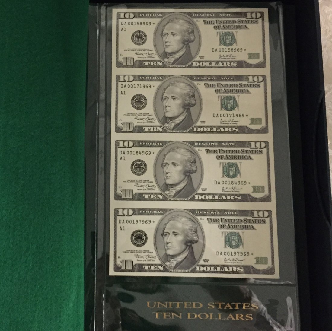 US Currency World Reserve Monetary Exchange Album: US Currency World Reserve Monetary Exchange Album in Presentation Case; Includes Mint Condition Uncut Notes; 4 Each of $1, $2, $5, $10, & $20 Notes. Face Value $152. Auction Estimate: $400-500.