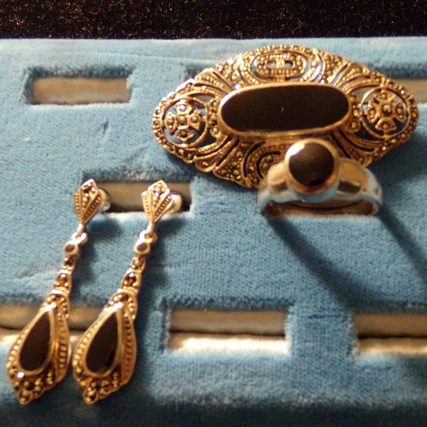Sterling Silver, Marcasite & Onyx Jewelry.: 3 pieces of Sterling Silver, Marcasite & Onyx Jewelry. Includes a Sterling Silver Marcasite & Onyx brooch and earrings & a Sterling Silver and Onyx ring, Size 8.5.
