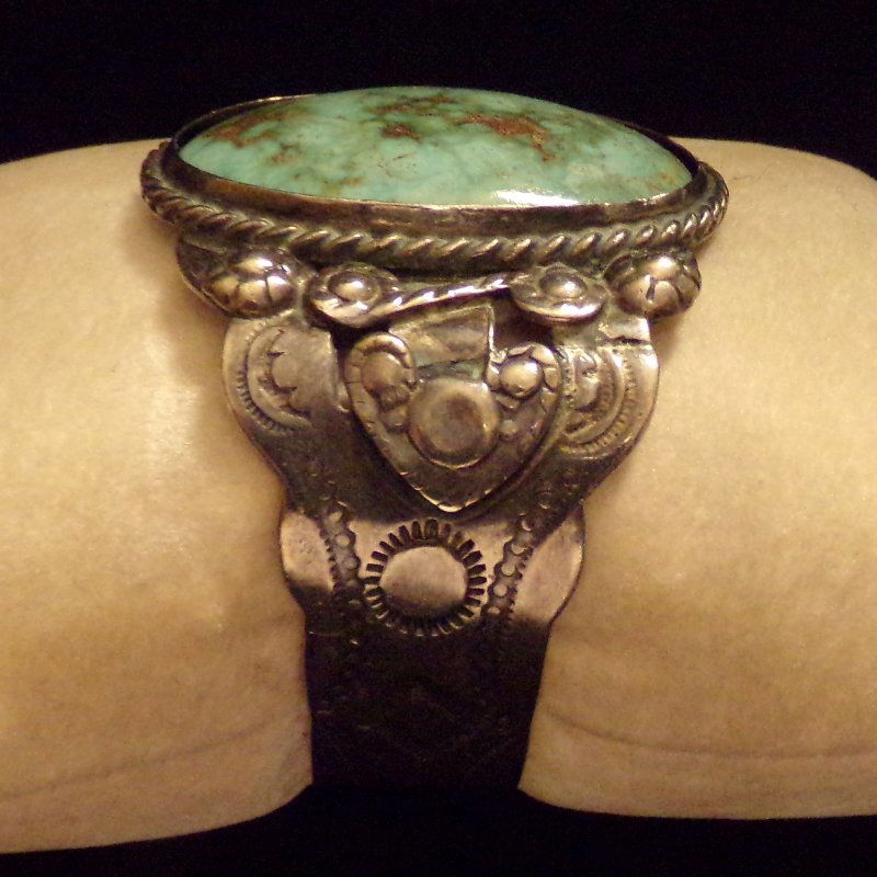 Indian Sterling Silver Turquoise Cuff Bracelet: Sterling Silver Turquoise Cuff Bracelet By A Native American Indian Artist. Center stone is bezel set & approx 1 1/2 x 1 1/8". Excellent handiwork on this antique piece!