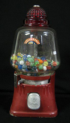 Early five cent bubble gum machine with red glass: Early five cent bubble gum machine with red glass top filled with early swirl marbles, 16" high.
