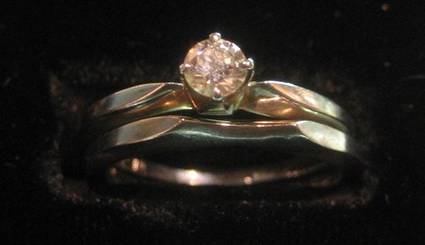 18 Kt. White Gold Wedding & Diamond Engagement Rings: 18 Kt. white gold wedding set with approximately 1/8 ct round diamond.