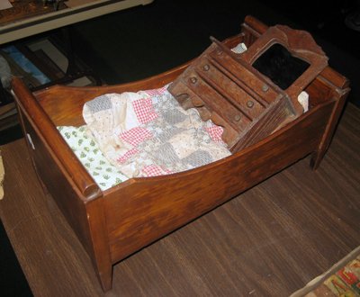 Collection of miscellaneous doll furniture.: Collection of miscellaneous doll furniture: sleigh bed, chest with high back mirror.