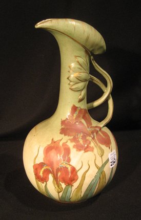 Amphora hand painted ceramic ewer with folded rim: Amphora hand painted ceramic ewer with folded rim, applied handle, decorated with flowers and leaves, 9" high - chipped at rim.