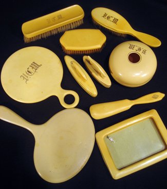 Collection of miscellaneous French ivory dresser: Collection of miscellaneous French ivory dresser items: two hand mirrors, two nail buffers, hair receiver, picture frame, three brushes and shoe horn - in poor condition. - Antique