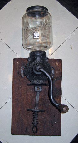 Antique Arcade Cast Iron Wall Mounted Coffee Grinder : Arcade cast iron wall mounted coffee grinder with glass jar, 20" high. The glass jar for holding the beans is marked "Crystal, NO. 3" with it's original tin cover that is marked "Arcade". The cast iro