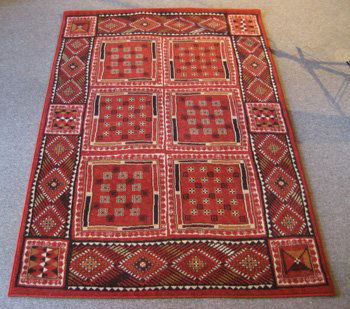 Tribal Design: Tribal Design ORIGIN: Egypt MATERIAL(S): Wool COLORS: rust, brown, ivory DETAILS: broad loom (power loom) SIZE/DIMENSIONS: 5'3" x 7'9"