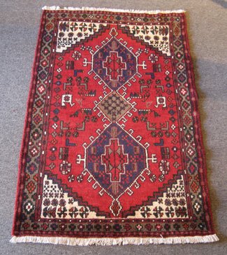 Persian Hamedan Rug: Persian Hamedan Rug ORIGIN: Iran MATERIAL: Wool COLORS: matter red, navy blue, ivory, natural brown, and others DETAILS: hand-knotted SIZE/DIMENSIONS: 3'5" x 5'4"