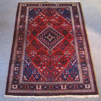 Persian Joshigan Semi-Antique1940-50's Rug: Persian Joshigan 1940-50's Semi-Antique Rug ORIGIN: Iran MATERIAL: wool COLORS: blue border, red background DETAILS: approx. 80kpsi, hand-knotted SIZE/DIMENSIONS: 4'7" x 6'10"