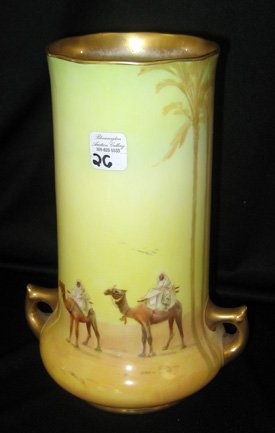 Royal Doulton 2-Handled Porcelain Vase, Desert Scene: Royal Doulton two-handled porcelain vase decorated with Middle Eastern landscape with figures on camels and palm trees in desert, 8-1/2" high.