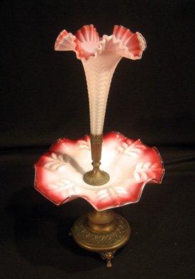 Red to white cased glass epergne with central vase: Red to white cased glass epergne with central vase on copper stand, 18-1/2" high - damage to base and central vase chipped off at base.