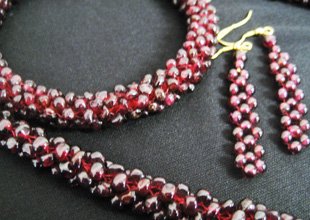 Endless woven Rhodolite Garnet necklace, bangle, earrin: Endless woven Rhodolite Garnet necklace, 25" long, matching woven Rhodolite Garnet bangle bracelet and dangle earrings (595+ cts).