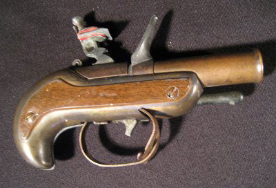 Dunhill brass figural dueling pistol cigarette lighter: Dunhill brass figural dueling pistol cigarette lighter, 6-1/4" long - trigger damaged.