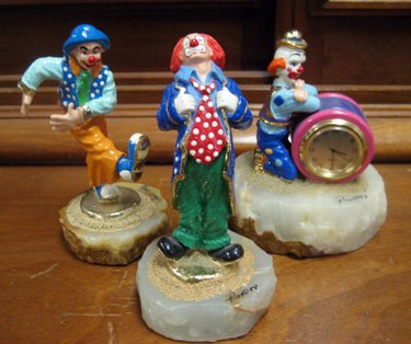Three limited edition Ron Lee clown figurines: Three Ron Lee limited edition clown figurines, "Spiffy", #CCG13, "Kix", #CCG14 and Clown Clock, #TP200, all approximately 5" high.