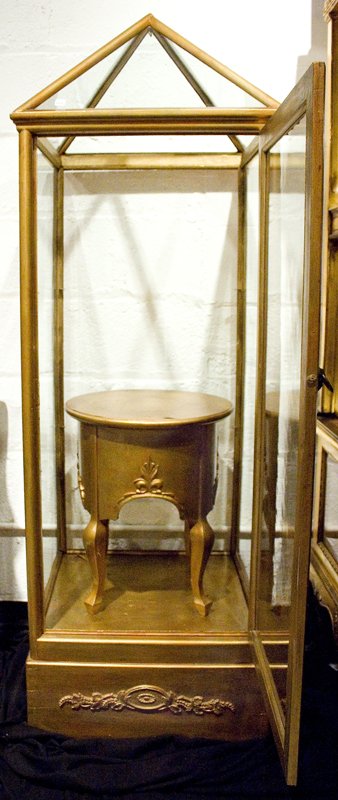 Gilded Wooden Display Case with Interior Stand: Gilded wooden display case with interior stand and peaked top AGE: Antique MARKINGS: CONDITION: SIZE: 62" high, 20.5" wide