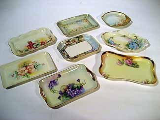 8 Miscellaneous porcelain pin trays: 8 Miscellaneous porcelain pin trays decorated with flowers: 3 Limoges, 3 Bavarian, 1 Nippon and 1 unmarked.