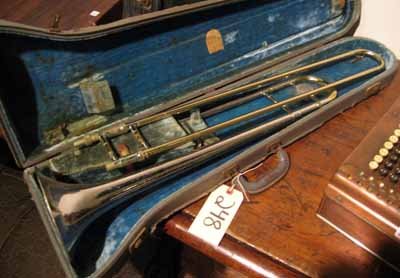 H.N. White "King" trombone in original case: H.N. White "King" trombone in original case - poor condition.