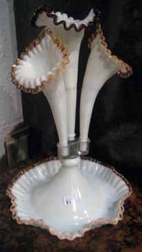 White glass epergne with 1 central vase & 3 side vases: White glass epergne with one central vase and three side vases, 17" high.