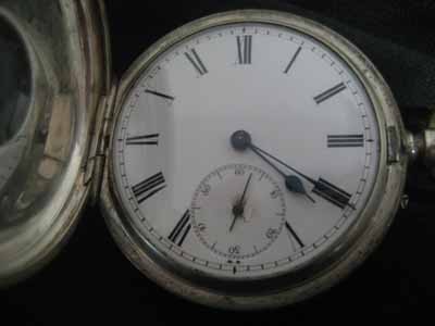 Hunting case pocket watch in sterling silver case: Unmarked hunting case pocket watch in sterling silver case - The piece appears to be in working order. However, due to the age, we cannot guarantee the future working condition of the piece.