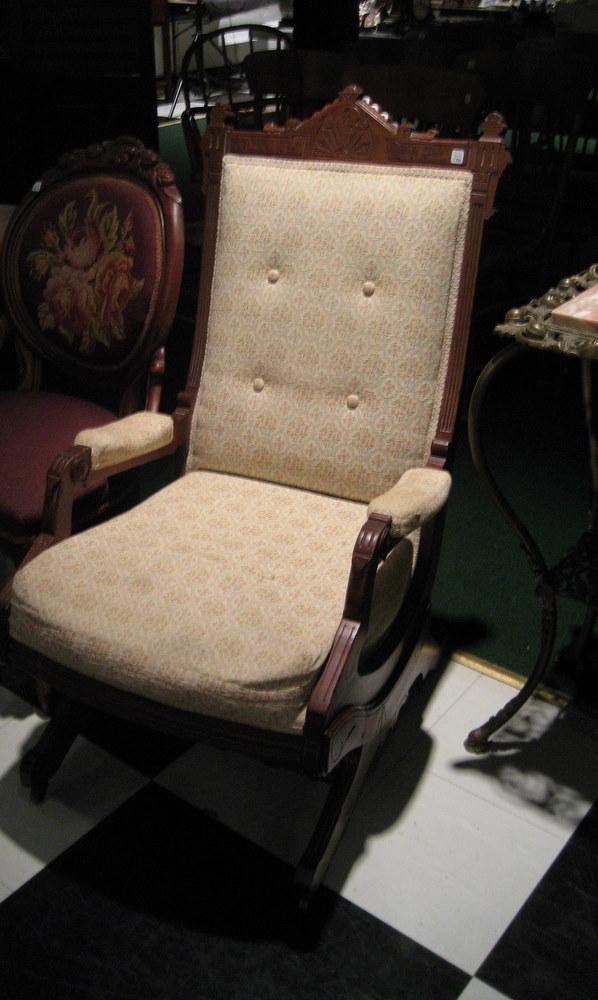 Victorian platform rocking chair: Victorian walnut and burlwood platform rocking chair with floral upholstery.