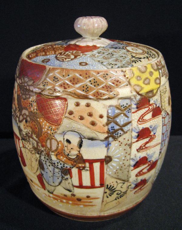 Japanese Earthenware Satsuma Lidded Biscuit Jar: Japanese earthenware Satsuma lidded biscuit jar. 7.25" high x 5.25" diameter.