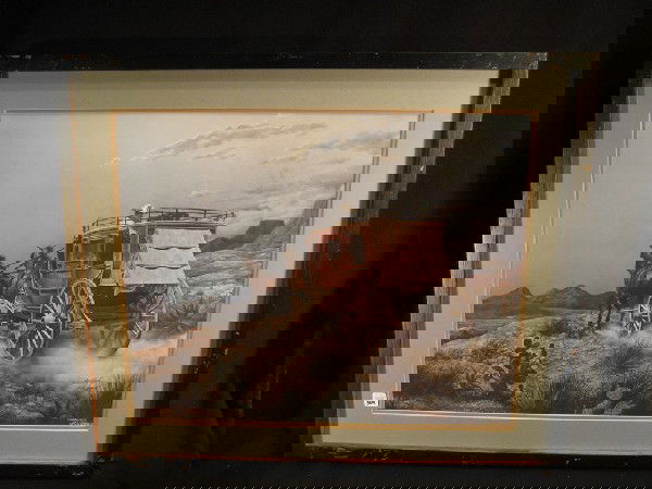 Framed limited edition western print: Framed limited edition western print with horse drawn stage coach moving through mountains, singed in pen and plate Larry Dyke #974/1000, 21" x 25" overall.