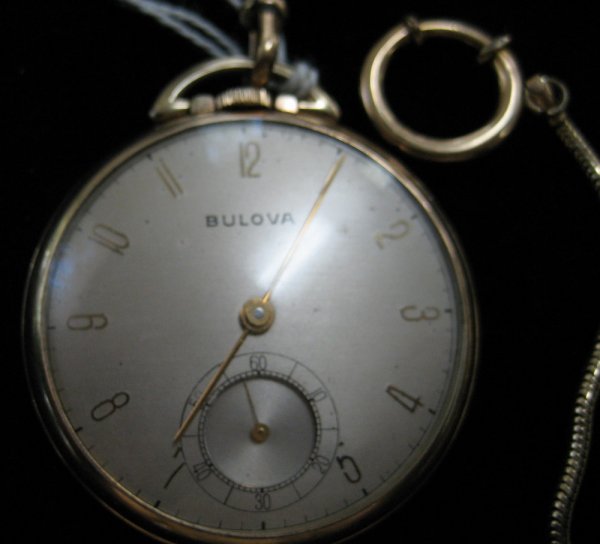 Bulova open face pocket watch in gold plated case: Bulova open face pocket watch, movement marked 17 jewels #17AH, in gold plated case with chain - the piece appears to be in working order. However, due to the age, we cannot guarantee the future worki