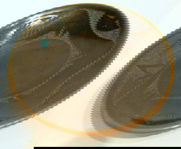 San Ildefonso Blackware Pottery Plate: San Ildefonso blackware pottery plate set with turquoise stone, signed on reverse Russell Sanchez May 1985, 6-1/2" diameter, 1" deep - no visible chips or cracks.