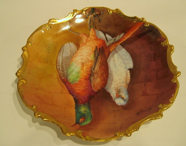 Signed Antique Hand Painted Limoges Charger: Antique Limoges hand painted porcelain charger decorated with game birds, signed A. Broussillay, 16" diameter.