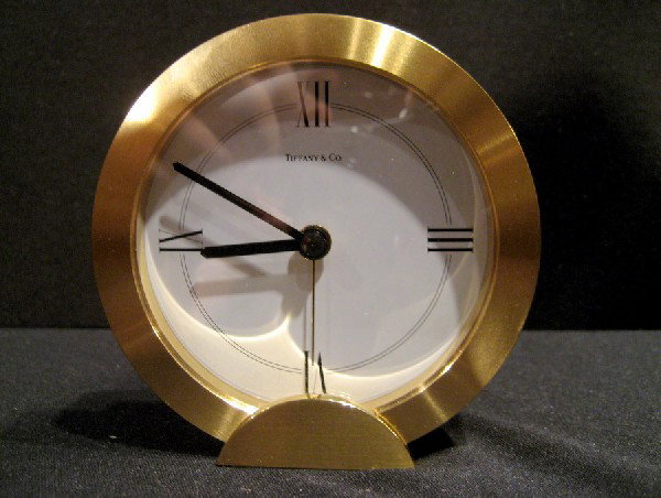 Tiffany & Co. Brass Framed Desk Clock: Tiffany & Co. brass framed desk clock with roman numeral dial, marked # 205738 on back, 3.5" high - not in working condition.