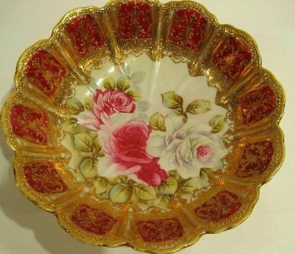 Hand painted Nippon bowl decorated with roses: Hand painted Nippon bowl decorated with roses and heavy enamel gilding - small chip on underside of rim, 11" diameter.