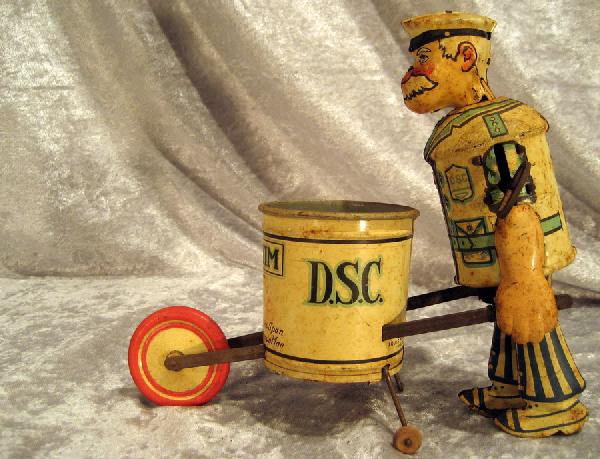 Tiny Tim Tin Toy: Tiny Tim vintage tin toy, 7.5" high, 9" wide - in working condition.