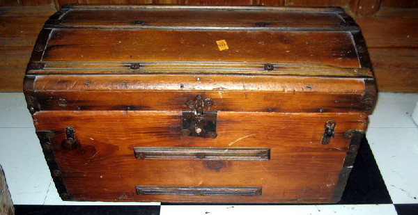 Antique Wooden Shipping Truck: Antique wooden shipping trunk with metal strapping and leather handles, 17" high, 28" wide.