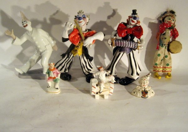 7 Miscellaneous Clowns: Seven miscellaneous clowns: B&G porcelain, 3 small porcelain, two pottery - both damaged and one cloth. Age: vintage.