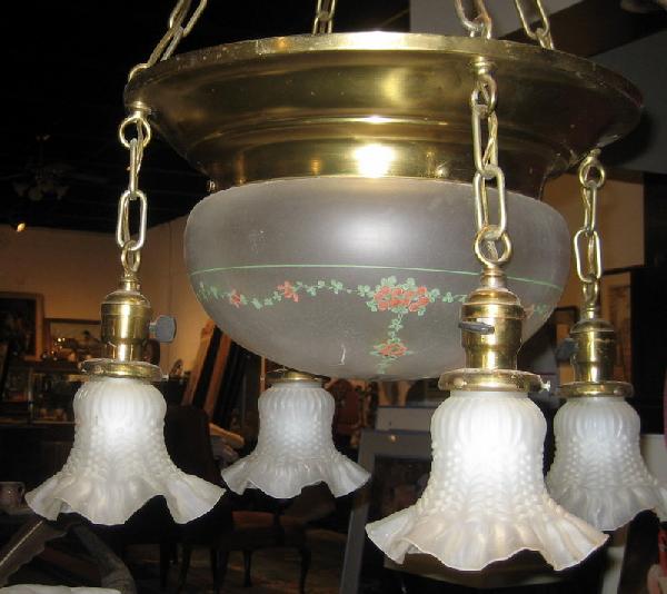 Brass Framed Hanging Light w/Frosted Glass Shade: Brass framed hanging light fixture with frosted glass central shade and four frosted glass hanging shades, 10" high, 16" diameter. Age: vintage.