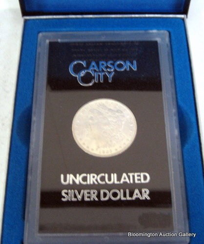 Uncirculated 1885 Carson City Morgan Dollar: Uncirculated 1885 Carson City Morgan Dollar in Case and Original Box. ***PLEASE NOTE, EXPRESS SHIPPING AVAILABLE FOR THIS ITEM: For an additional handling fee of $15.00, this item will be shipped with