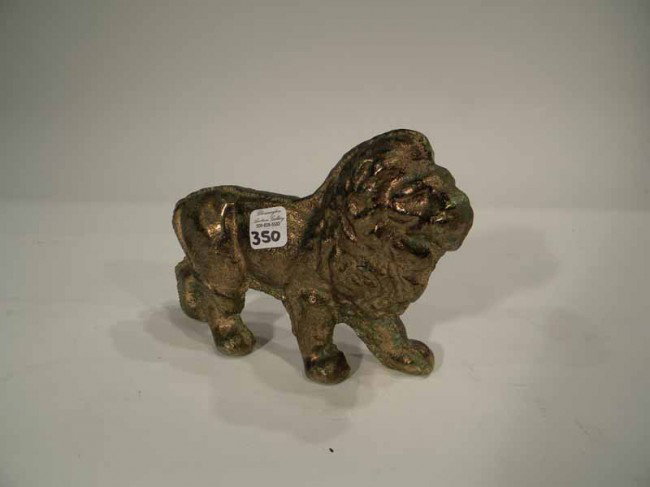 Cast Iron Figural Lion Doorstop: Cast iron figural lion door stop - modern - 5"h x 7"w