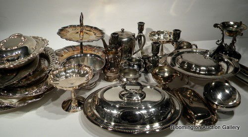 45 Pc Silver Plated Items: 45 Piece silver plate items - 5 oval trays, 4 round trays, 2 tureens, 3 trivets, 2 tier tray, 3 pedestal dishes, oval dish, 2 round bowls, teapot, 3 creamers, 2 sugars, 2 small bowls, 4-branch candles